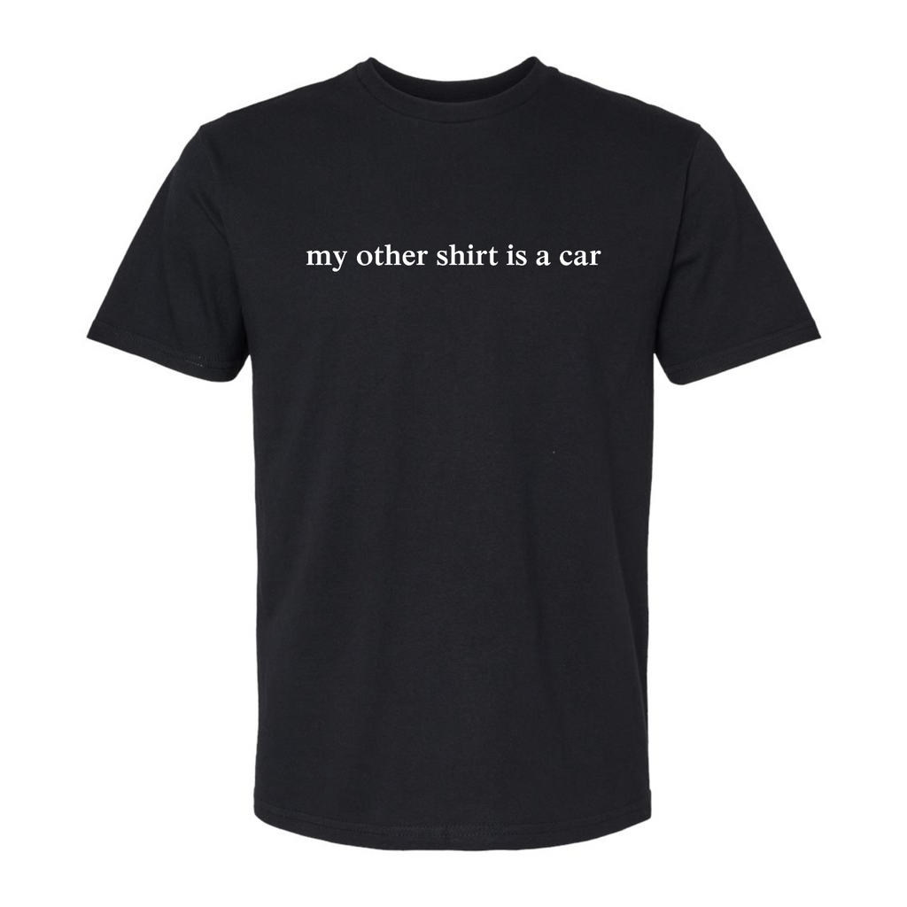 Black short sleeve t shirt that has white serif font text on the center chest that says, "my other shirt is a car"