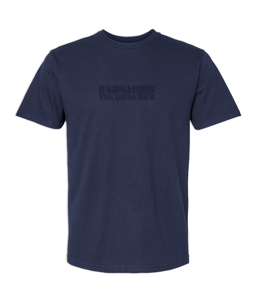 Navy blue short sleeve t-shirt with embroidered tonal text in the front center chest that says, "Dungeons & Daddies The Areas Tour"