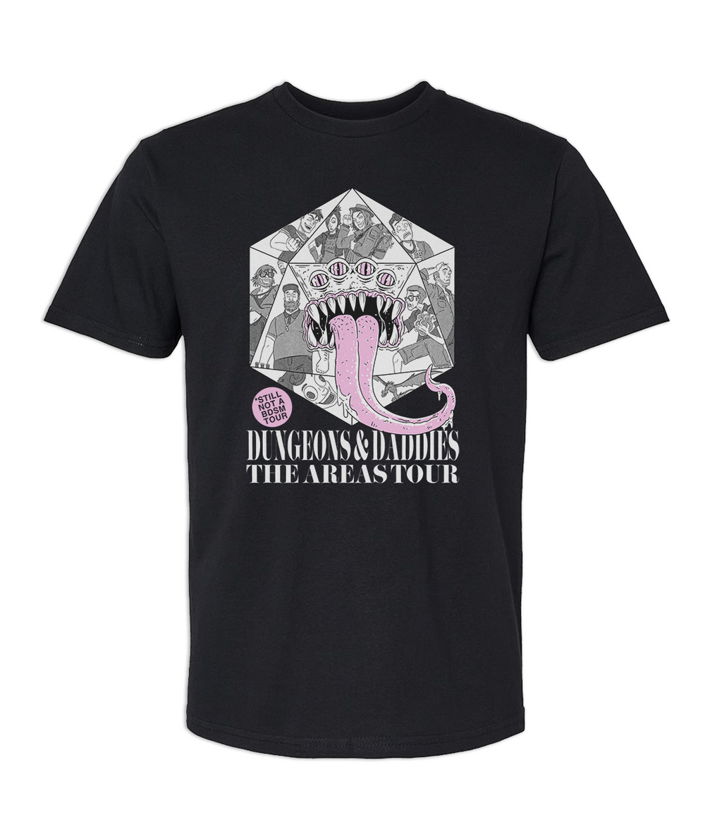 Black t shirt with white, gray, and bubblegum pink print of a large D20 in the center of the chest filled with illustrations of the dungeons and daddies characters. A monster face with pink eyes and sharp teeth with its tongue sticking out is also on the D20 making it look like a monster. Text beneath the printed illustration reads, "Dungeons & Daddies The Areas Tour". There is a pink bubble with black text right below the illustration that reads, "STILL NOT A BDSM TOUR"